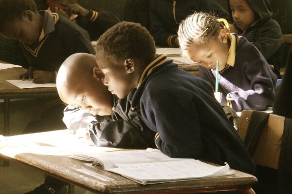 Children in classroom studying