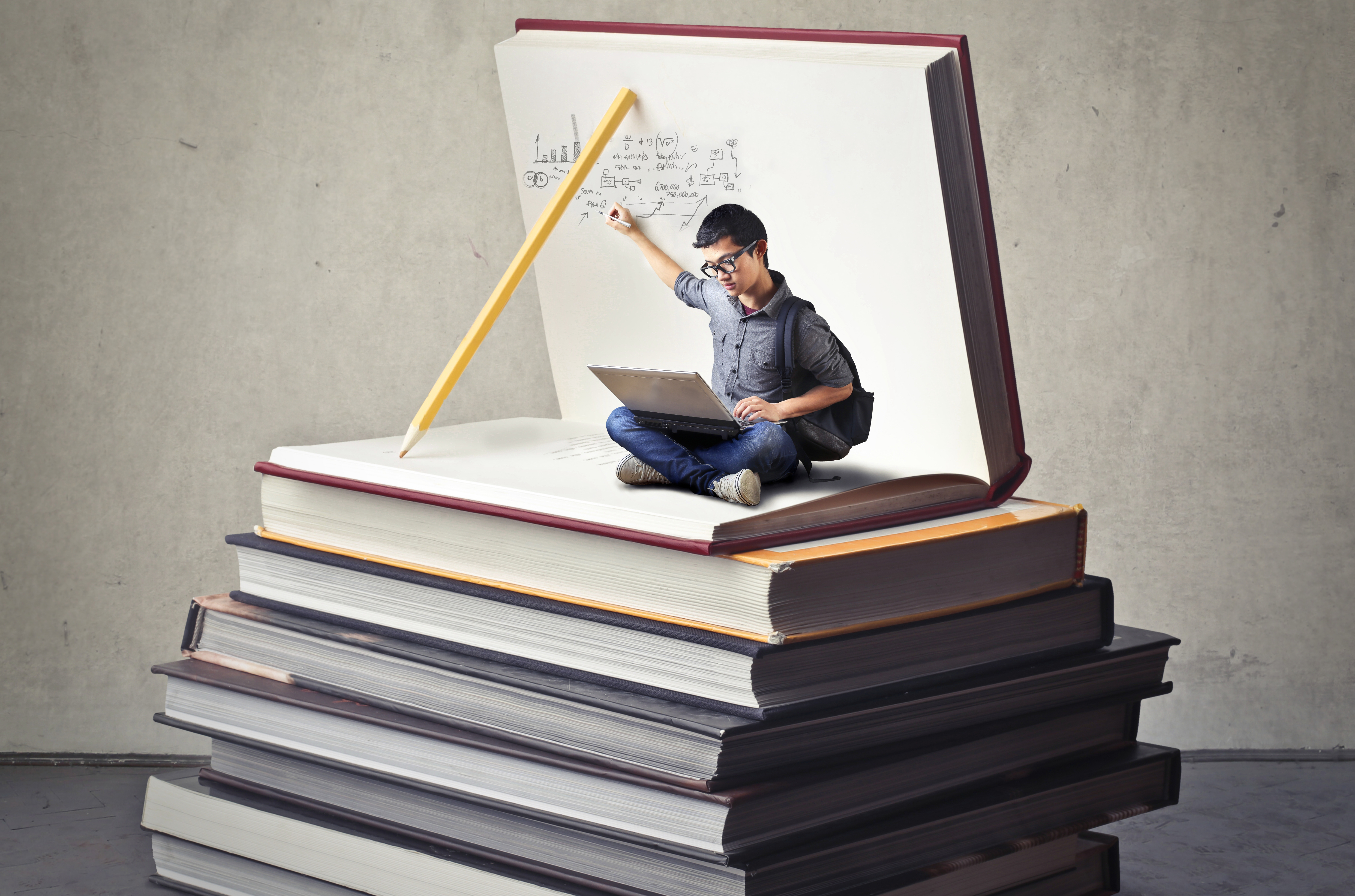 A graphic of a student sitting on books
